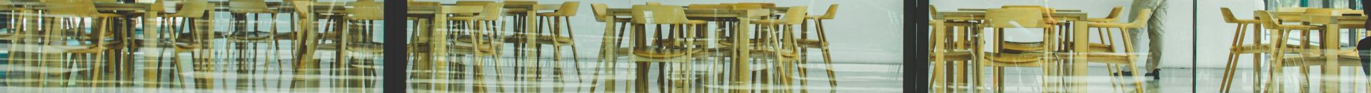 Contemporary café with glass walls showcasing a sleek interior design in Cupertino, California.