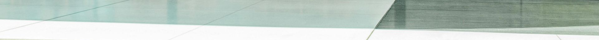 Contemporary café with glass walls showcasing a sleek interior design in Cupertino, California.