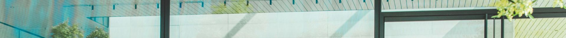 Contemporary café with glass walls showcasing a sleek interior design in Cupertino, California.