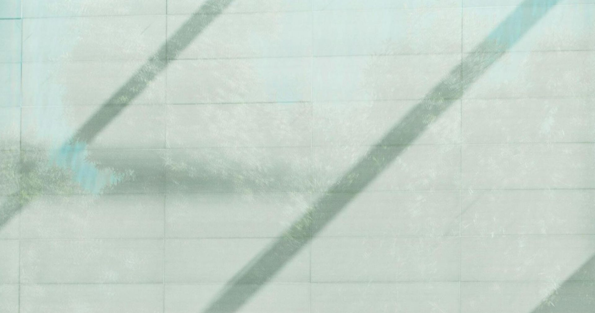 Contemporary café with glass walls showcasing a sleek interior design in Cupertino, California.